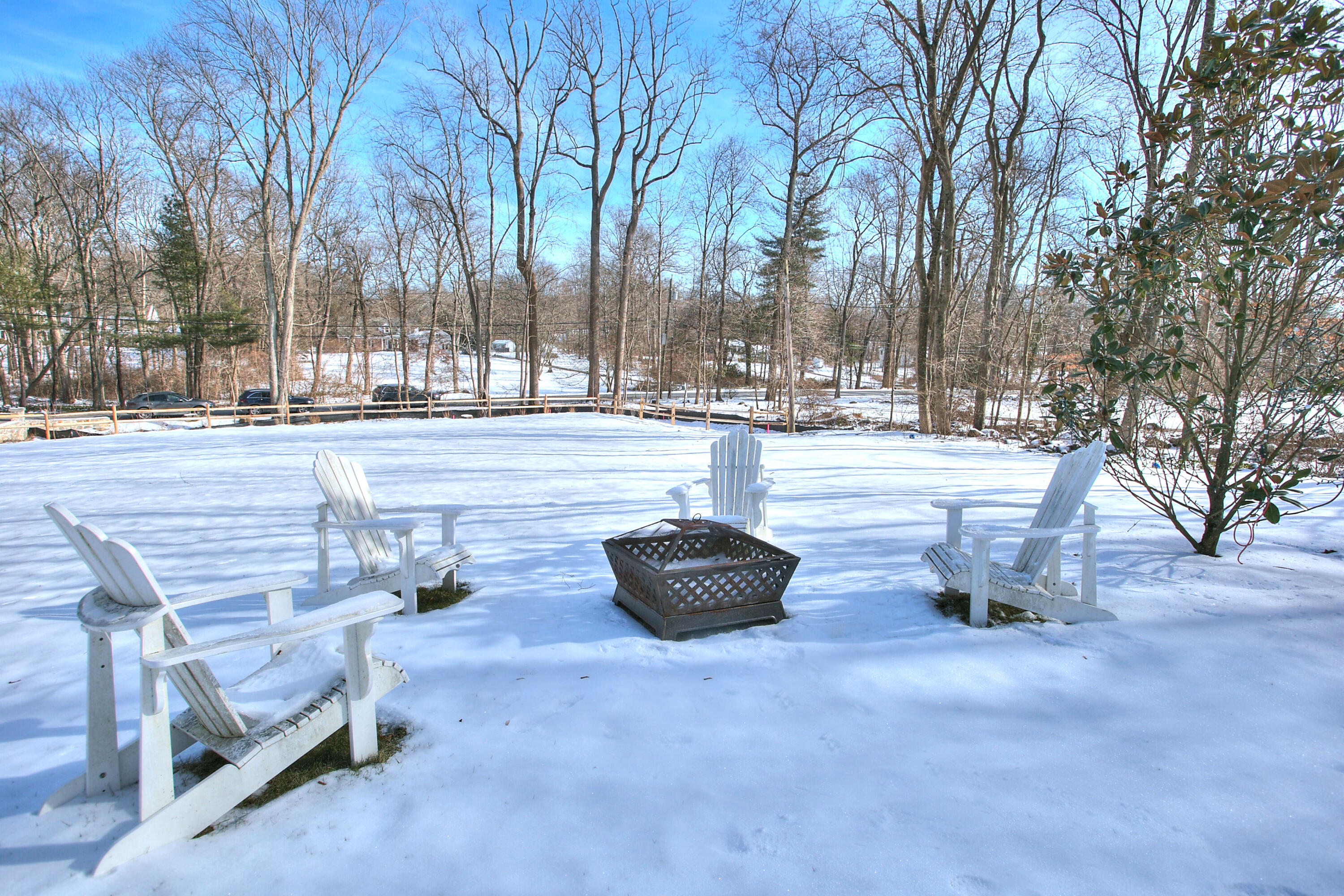 45 Beech Road New Canaan, CT 06840 - Photo 34 of 37 a view of a patio with a fire pit and a trees