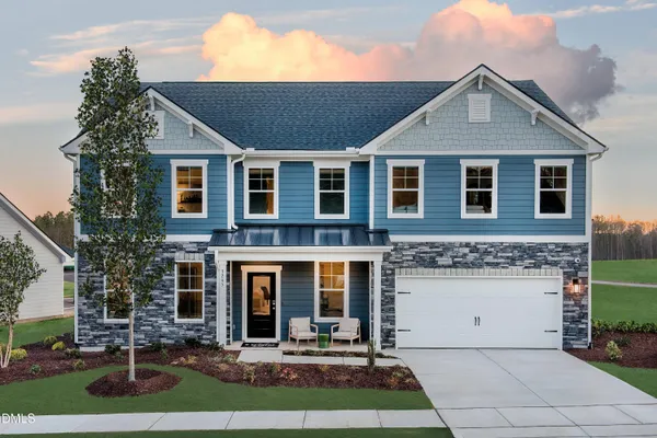 a front view of a house with yard