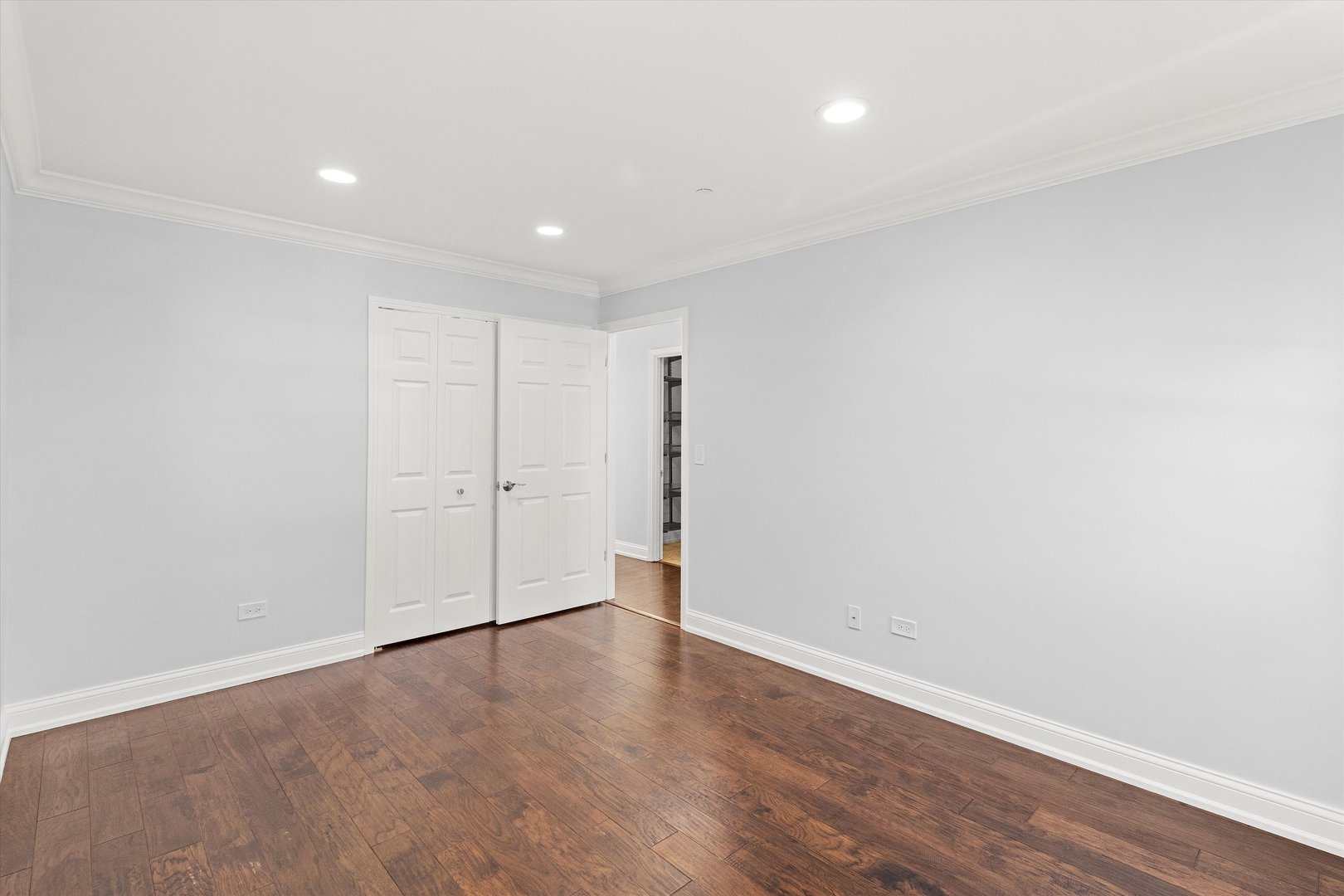 1615 West Hawkes Street, Unit 5 Arlington Heights, IL 60004 - Photo 13 of 17 a view of an empty room with wooden floor