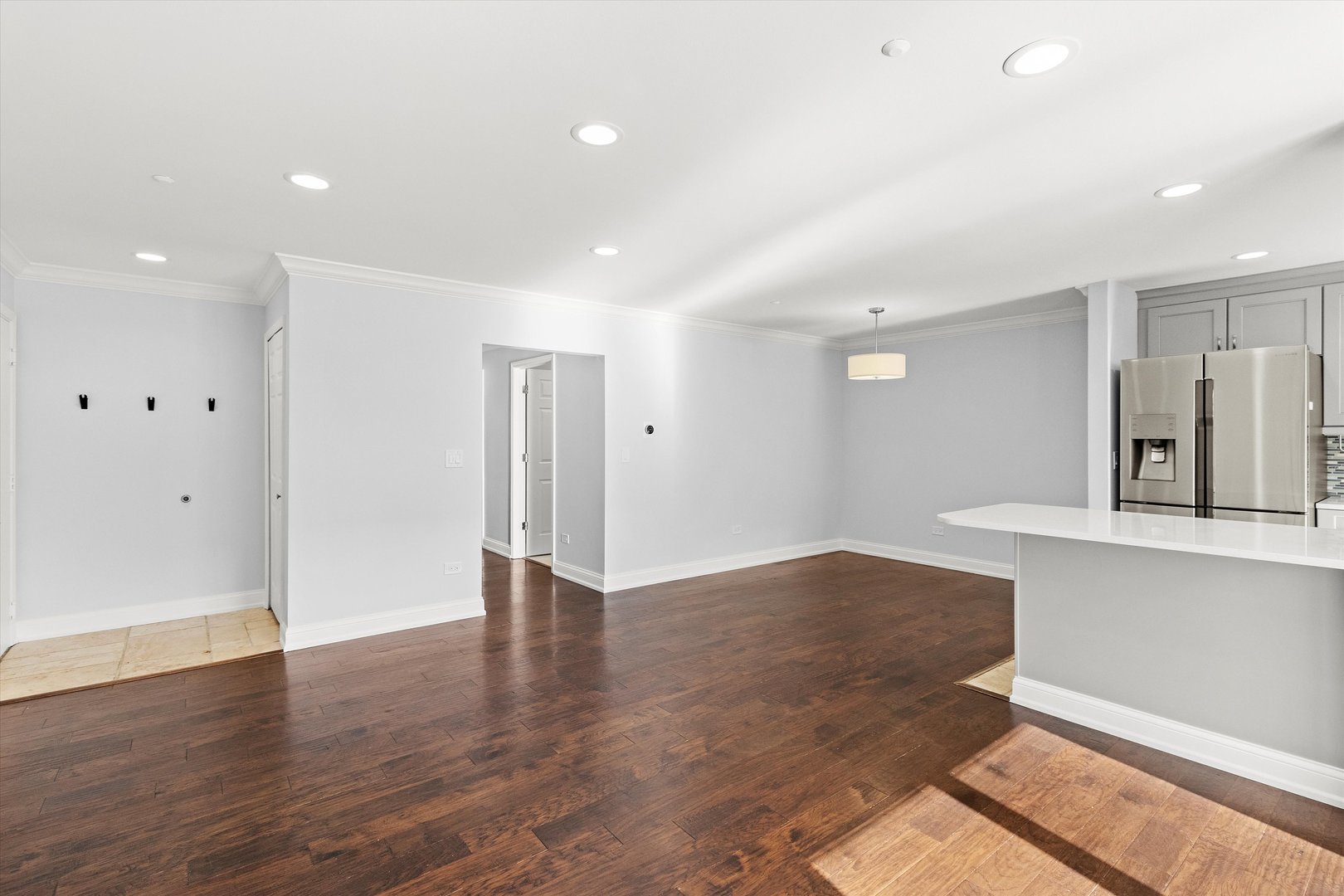 1615 West Hawkes Street, Unit 5 Arlington Heights, IL 60004 - Photo 5 of 17 a view of kitchen with wooden floor and electronic appliances