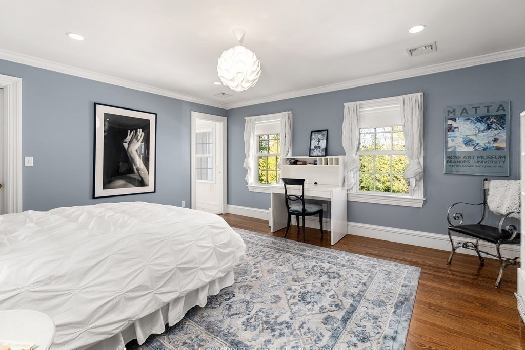 16 Sanderson Lane Weston, MA 02493 - Photo 18 of 39 a bedroom with a bed and wooden floor