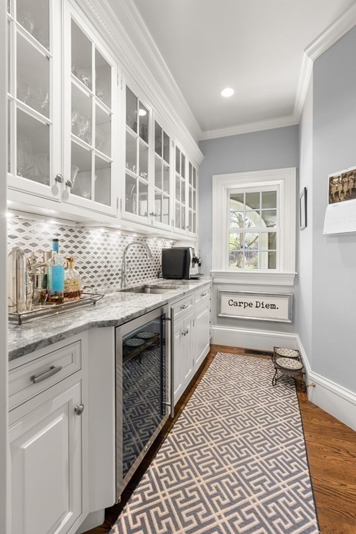 16 Sanderson Lane Weston, MA 02493 - Photo 25 of 39 a kitchen with stainless steel appliances a stove and white cabinets