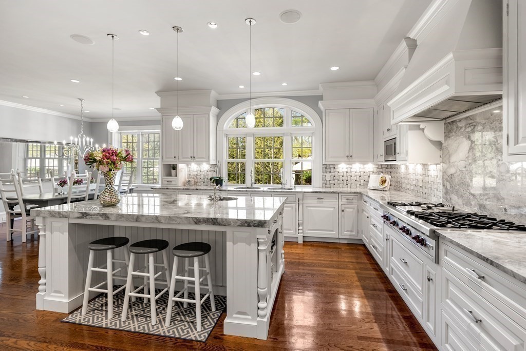 16 Sanderson Lane Weston, MA 02493 - Photo 26 of 39 a kitchen with stainless steel appliances granite countertop a stove and a view of living room