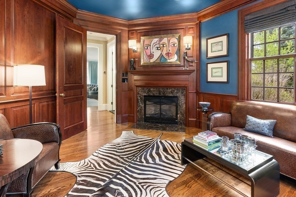 16 Sanderson Lane Weston, MA 02493 - Photo 31 of 39 a living room with furniture and a fireplace