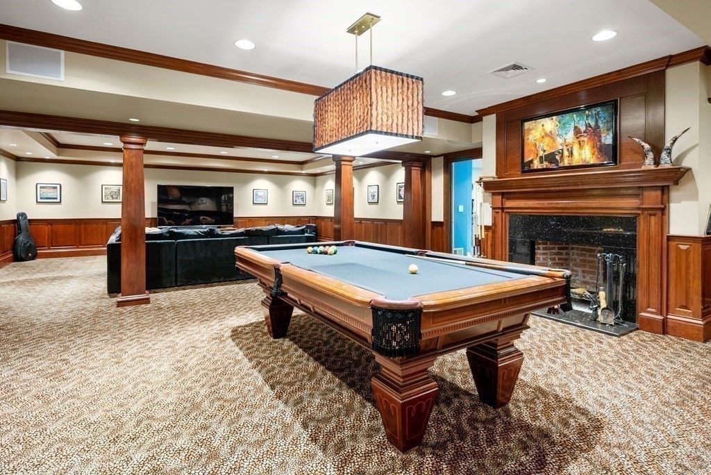 16 Sanderson Lane Weston, MA 02493 - Photo 33 of 39 a living room with stainless steel appliances furniture a fireplace and a open kitchen view