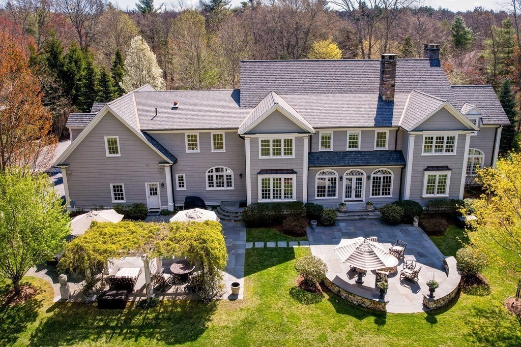 16 Sanderson Lane Weston, MA 02493 - Photo 37 of 39 a front view of a house with yard swimming pool and outdoor seating