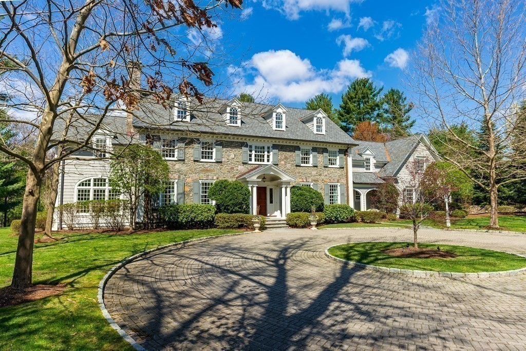 16 Sanderson Lane Weston, MA 02493 - Photo 5 of 39 a front view of a building with a garden