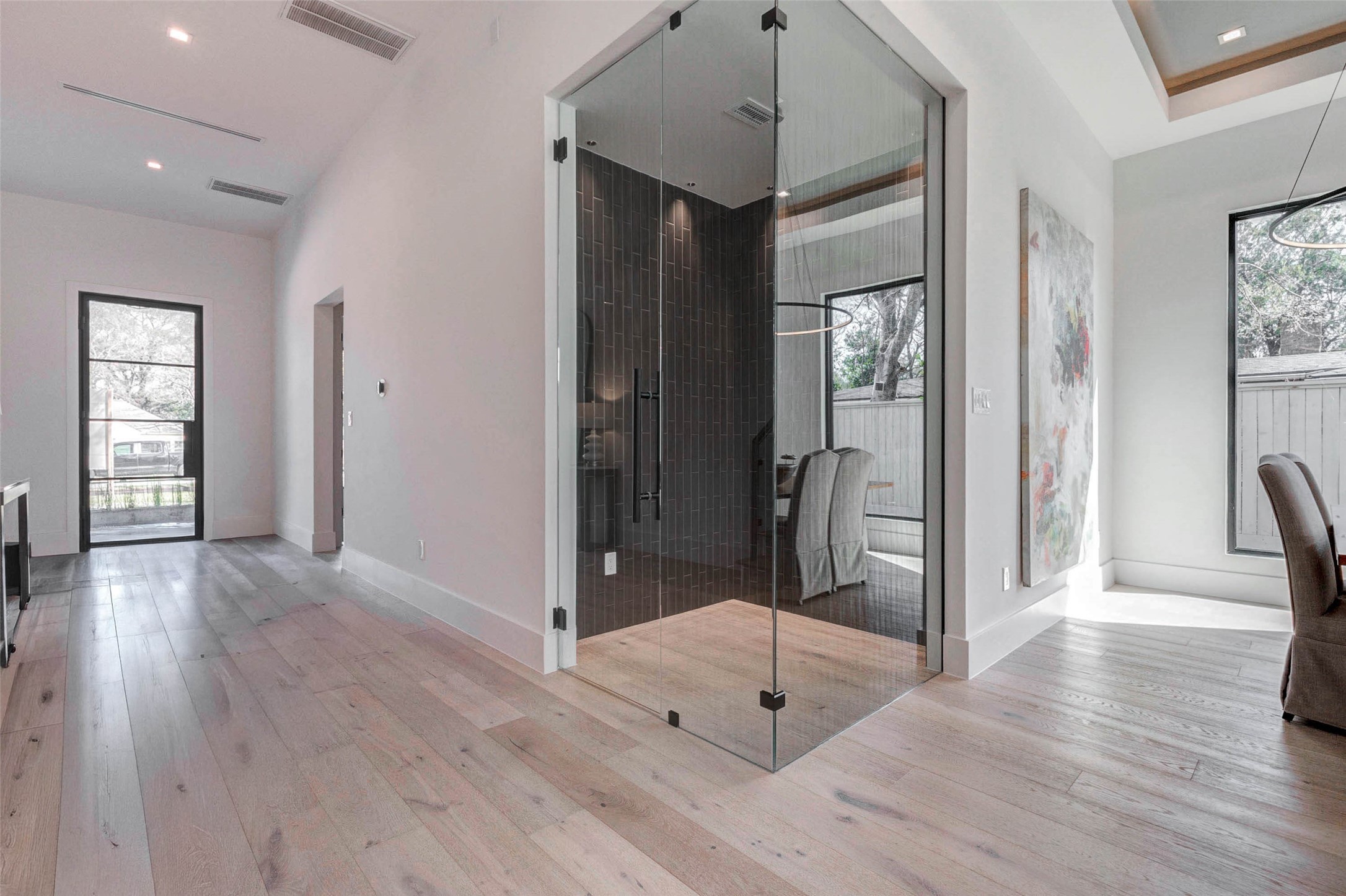 207 West 33rd Street Houston, TX 77018 - Photo 12 of 50 Custom glass wine room designed to showcase your collection while adding a sophisticated architectural element to the home.