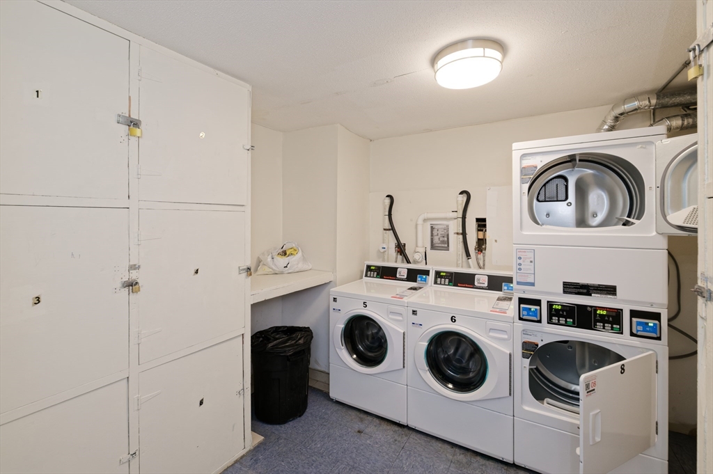 2 Universal Street, Unit 4 Framingham, MA 01702 - Photo 12 of 18 a utility room with sink dryer and washer