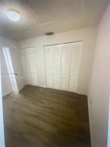 an empty room with a empty space and a window