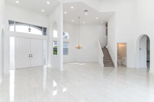 an empty room with wooden floor