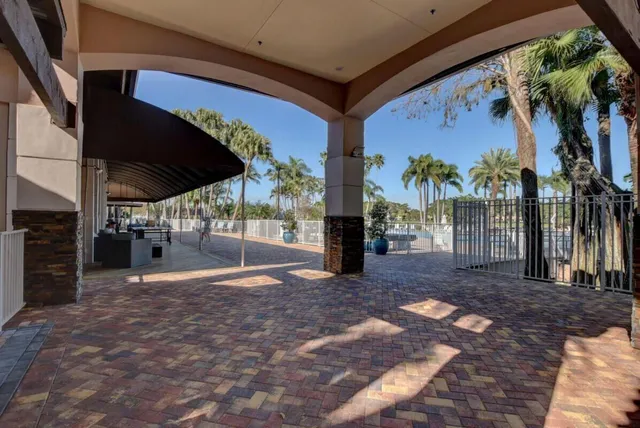 an aerial view of a house with a garden and swimming pool