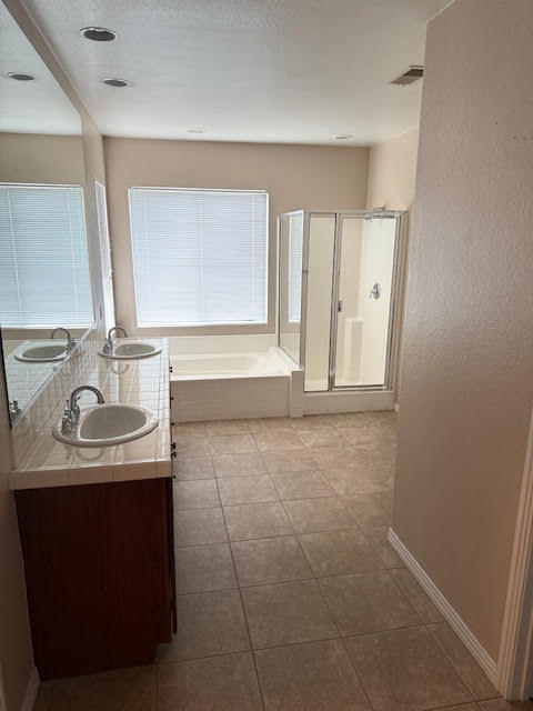 84476 Ruebens Way Coachella, CA 92236 - Photo 32 of 47 a bathroom with a sink a vanity and a mirror