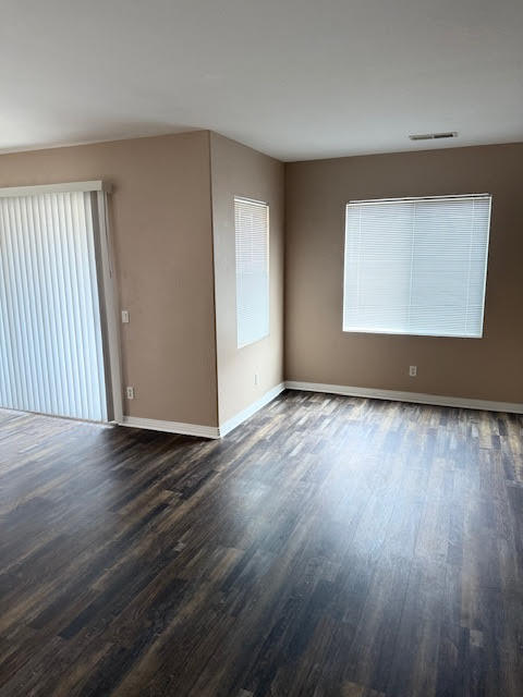 84476 Ruebens Way Coachella, CA 92236 - Photo 34 of 47 an empty room with wooden floor and windows