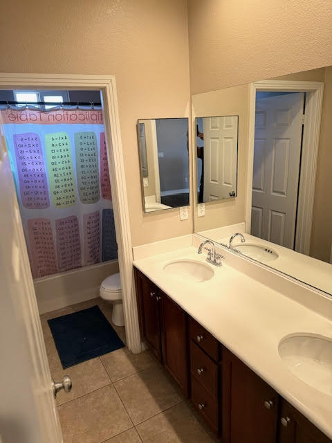 84476 Ruebens Way Coachella, CA 92236 - Photo 37 of 47 a bathroom with a sink a toilet a mirror and shower