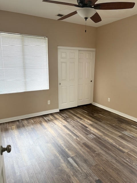 84476 Ruebens Way Coachella, CA 92236 - Photo 41 of 47 an empty room with wooden floor fan and windows