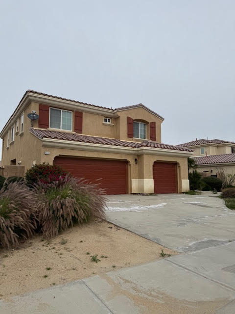 84476 Ruebens Way Coachella, CA 92236 - Photo 47 of 47 a front view of a house with a yard
