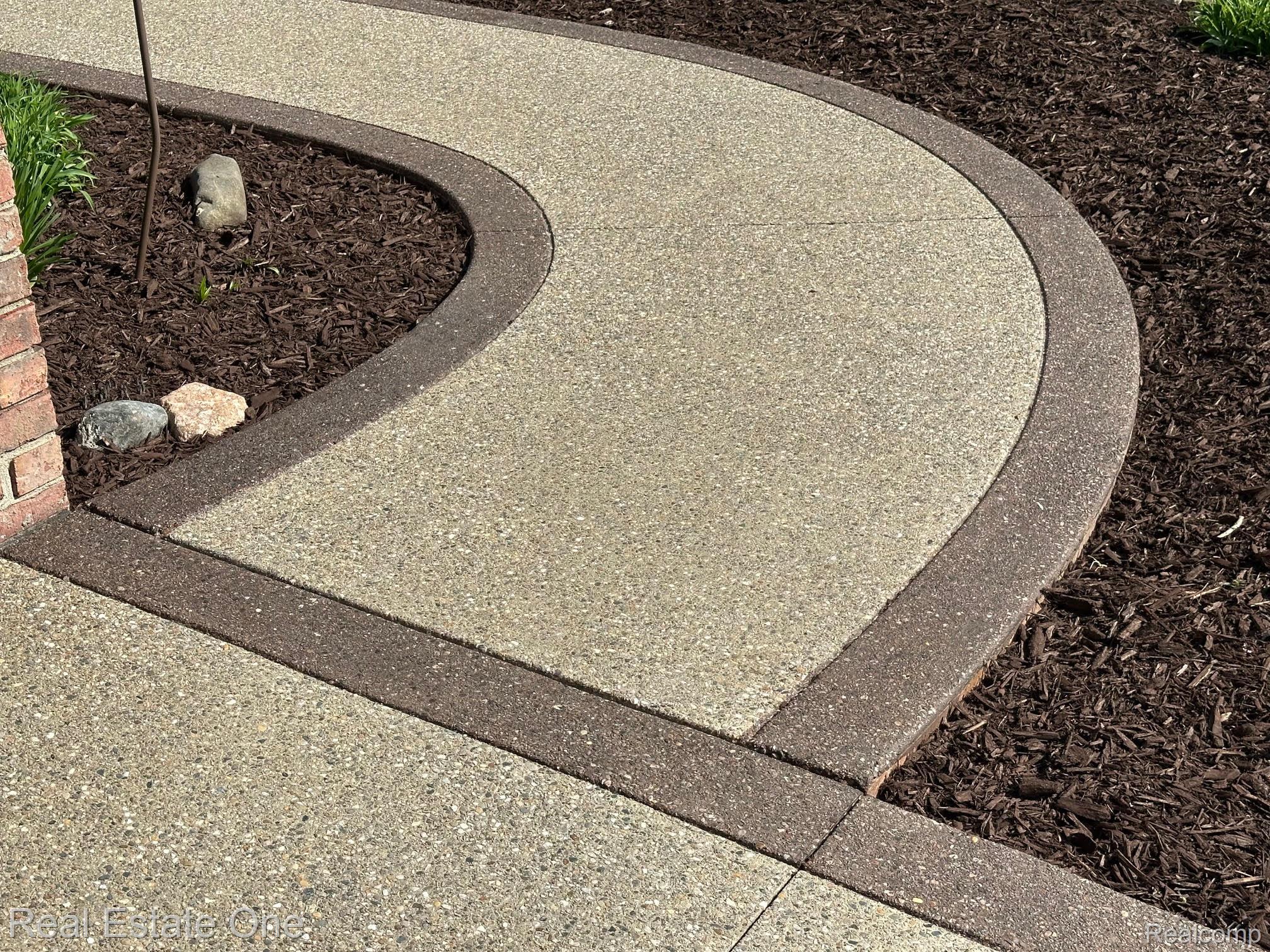 3648 West Tienken Road Rochester, MI 48306 - Photo 53 of 61 Aggregate Walkway with Colored Border.