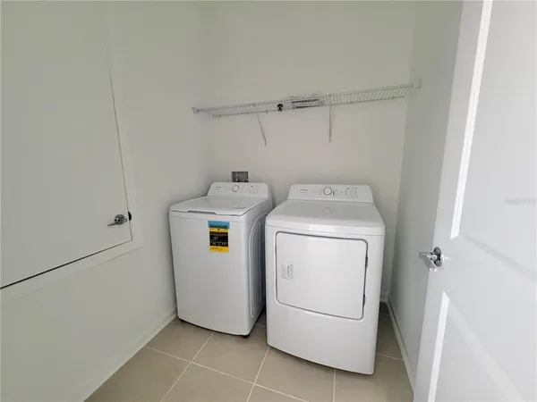 an empty room with closet and a bathroom