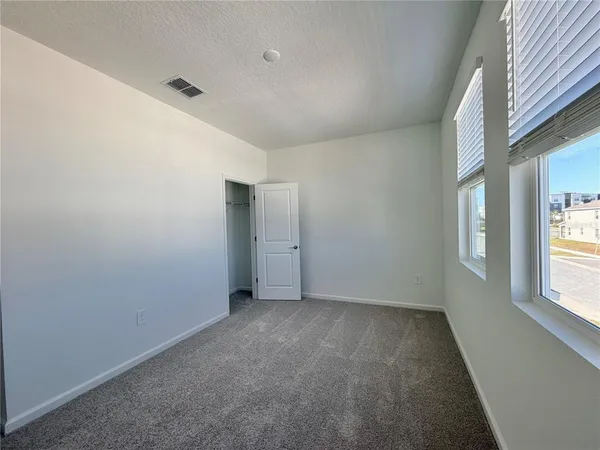 an empty room with a natural light