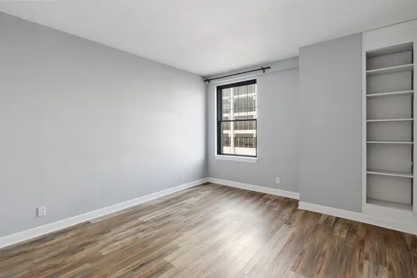 a dining hall with stainless steel appliances kitchen island granite countertop a table and chairs