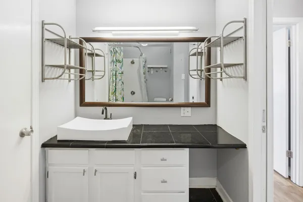 a view of a patio with dining table and chairs