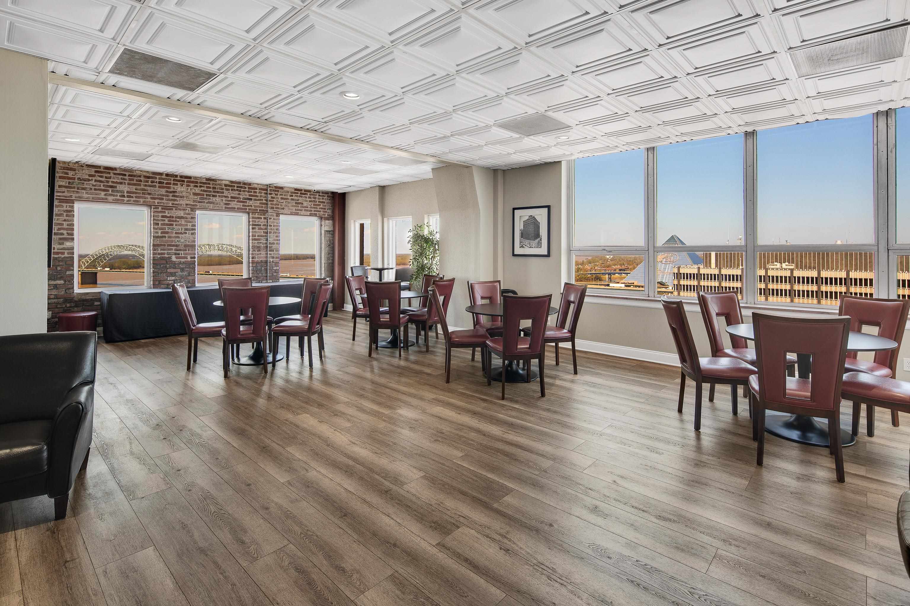 109 North Main Street, Unit 412 Memphis, TN 38103 - Photo 20 of 35 a view of a dining room with furniture window and wooden floor