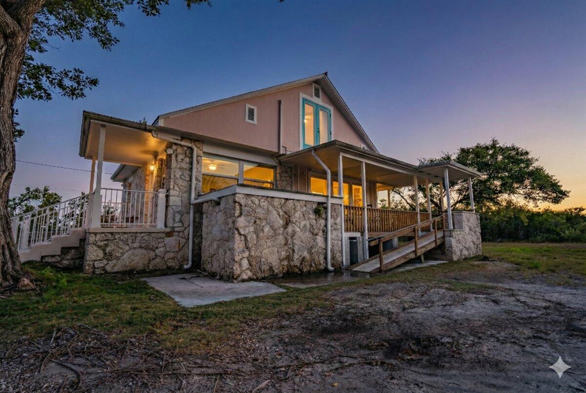 3167 Stewart Road Summerland Key, FL 33042 - Photo 2 of 33 a view of a house with a yard