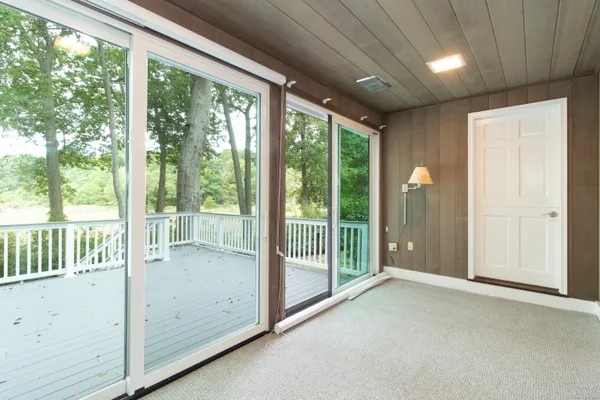 a view of a room with large windows