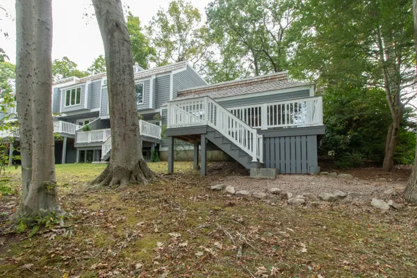 a view of balcony with wooden floor and fence