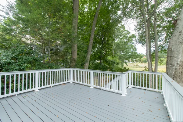a view of house with backyard space and balcony