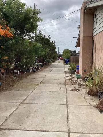 a view of a pathway with a patio