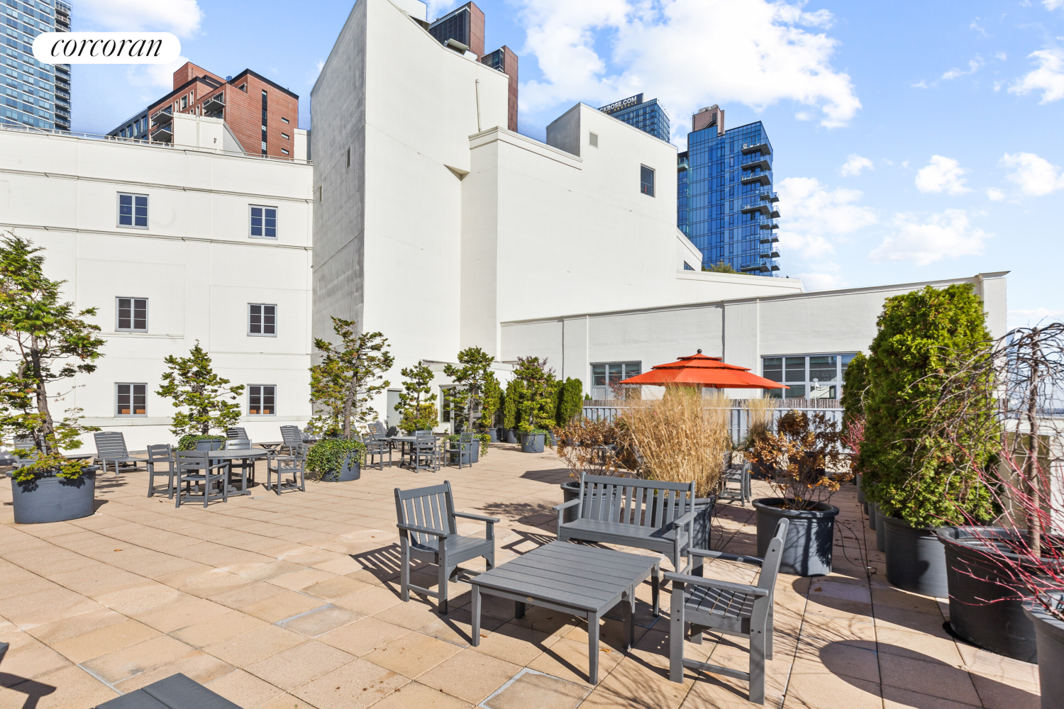 27-28 Thomson Avenue, Unit 228 Queens, NY 11101 - Photo 13 of 17 a outdoor space with lots of tables and chairs