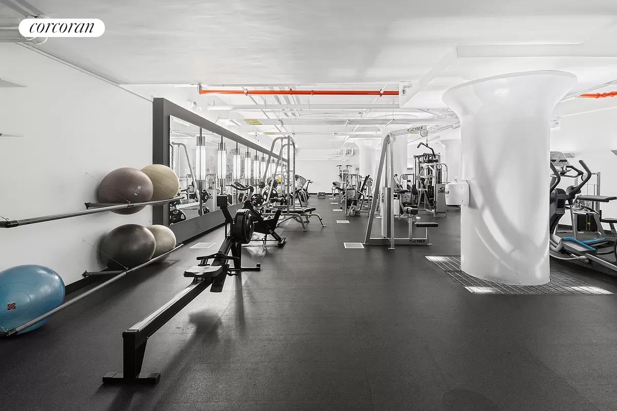 27-28 Thomson Avenue, Unit 228 Queens, NY 11101 - Photo 16 of 17 a view of a room with gym equipment