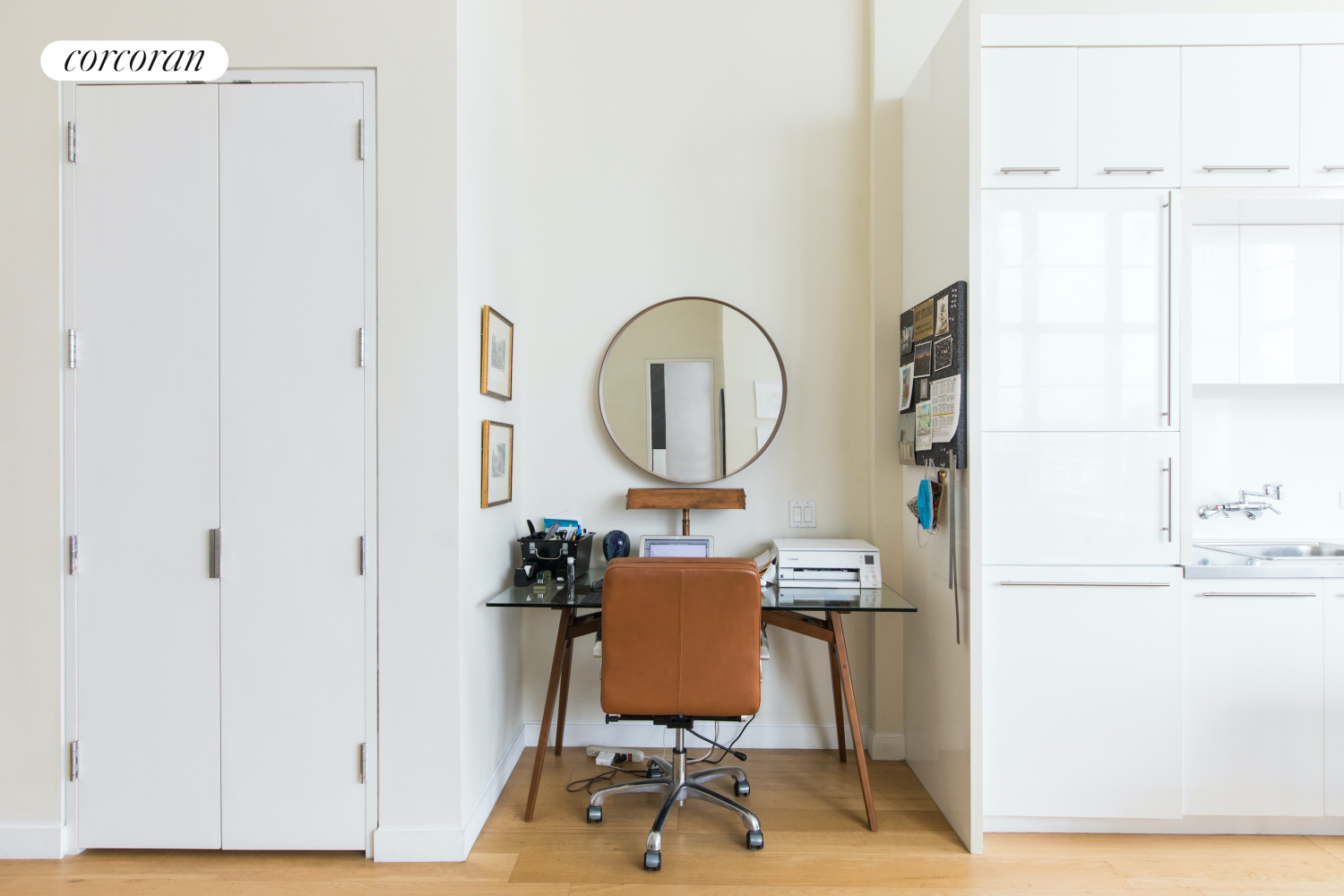 27-28 Thomson Avenue, Unit 228 Queens, NY 11101 - Photo 3 of 17 a room with furniture and a mirror