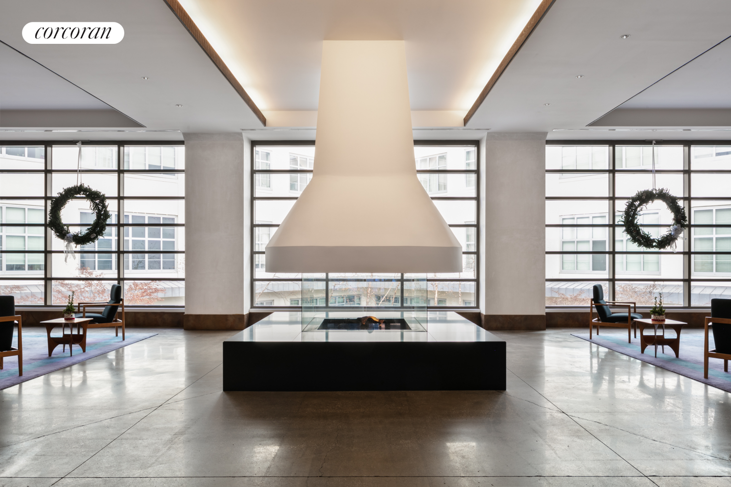 27-28 Thomson Avenue, Unit 228 Queens, NY 11101 - Photo 9 of 17 a living room with couches and a large window with pool table