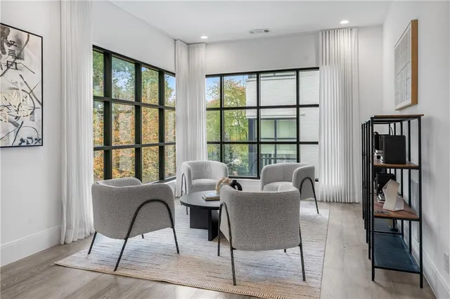 a view of a dining room with furniture window and wooden floor