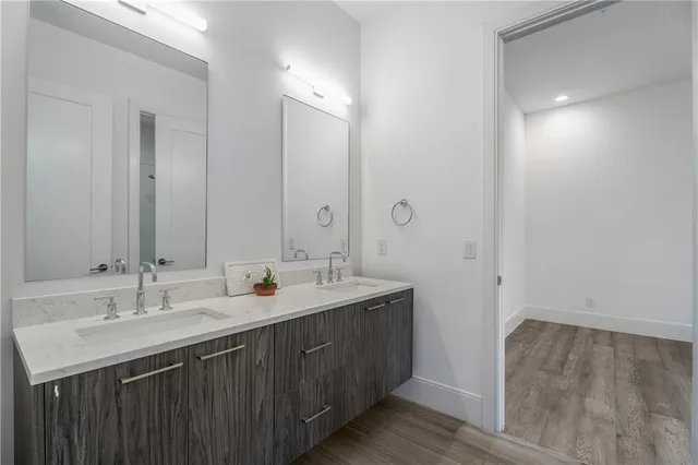 a bathroom with 2 sink and a mirror