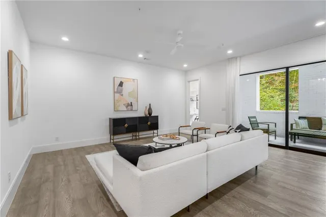 a living room with furniture and a large window