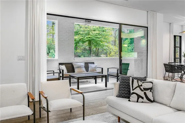 a living room with furniture and a large window