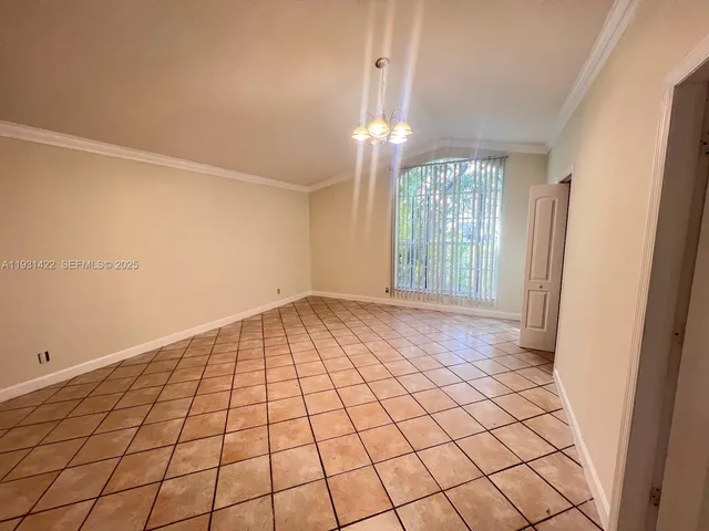 a view of an empty room and window