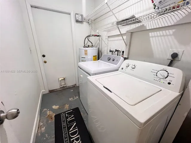 a utility room with dryer and washer