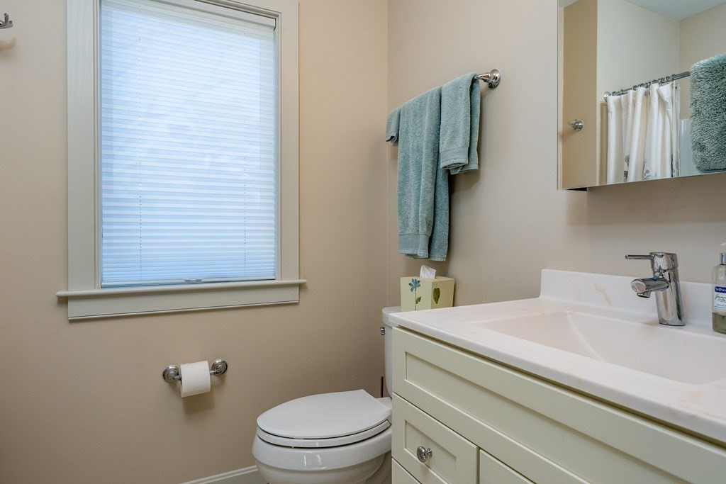 288 Training Field Road Chatham, MA 02633 - Photo 18 of 27 a bathroom with a toilet sink and mirror