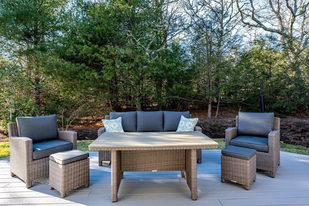 288 Training Field Road Chatham, MA 02633 - Photo 5 of 27 a outdoor sitting area with furniture and wooden floor