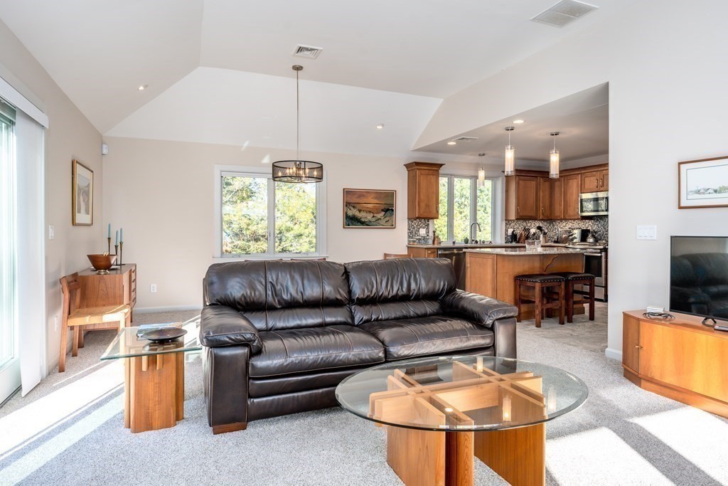 288 Training Field Road Chatham, MA 02633 - Photo 6 of 27 a living room with furniture and a chandelier