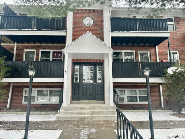 a front view of a house with glass windows