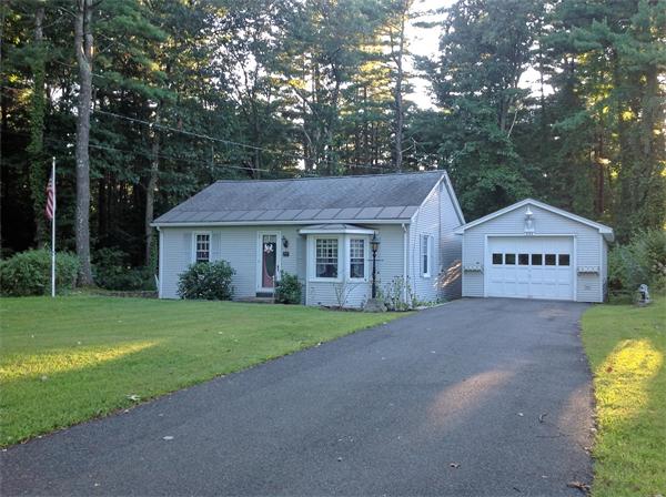 235 Glendale Road Northampton, MA 01062 - Photo 1 of 15 a front view of a house with a yard and garage
