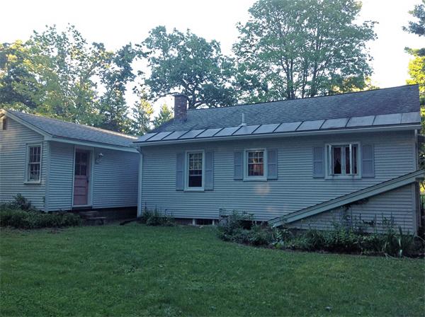 235 Glendale Road Northampton, MA 01062 - Photo 2 of 15 a brick house next to a yard with a large tree