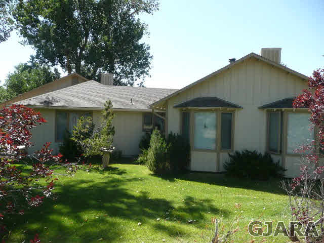 1111 Sundial Road Grand Junction, CO 81505 - Photo 12 of 12 a front view of a house with garden