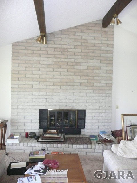 1111 Sundial Road Grand Junction, CO 81505 - Photo 3 of 12 a living room with furniture and a fireplace